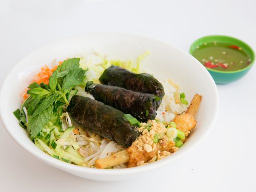 Vermicelli with grilled spicy beef wrapped in herb leaves