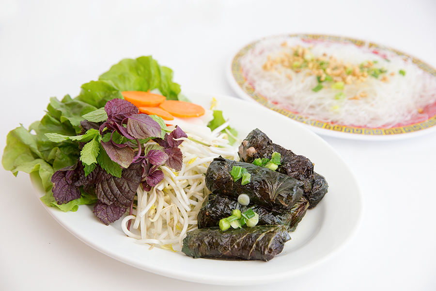 Grilled spicy beef wrapped in herb leaves served with vermicelli and rice paper